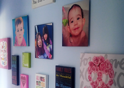 Wall grouping of prints, paintings, and photos
