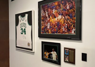 Sports memorabilia wall in office